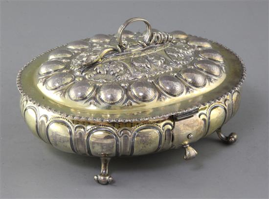 A late Victorian embossed silver gilt oval casket, By Carrington & Co, 18 oz.